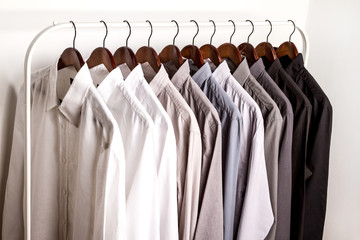 Several shirts on a hanger.