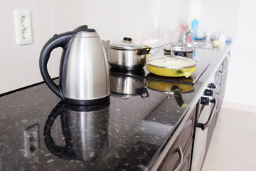 Interior of a modern kitchen. Close-up electric kettle - obrazy, fototapety, plakaty