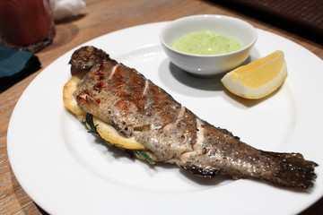 Grilled trout on a plate