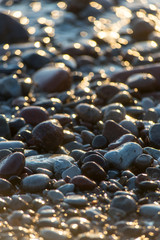 Stones on beach and sea water