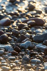 Stones on beach and sea water