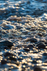 Stones on beach and sea water