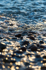 Stones on beach and sea water