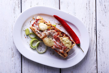 Tasty sandwich with bacon and cheese