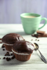 Tasty homemade chocolate muffins and cup of coffee
