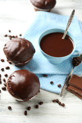 Tasty homemade chocolate muffins and cup of coffee