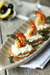 Appetizer canape with shrimp and cucumber