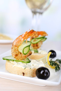 Appetizer canape with shrimp and olives