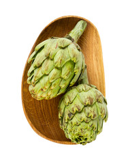 artichokes in a wooden plate