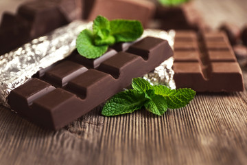 Set of spicy chocolate on wooden table, closeup
