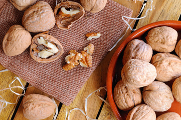 Group of healthy walnuts on a wooden table top view