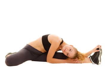 Fototapeta premium woman in sportswear doing stretching exercise