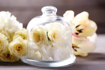 Beautiful composition with flowers on grey wooden  background