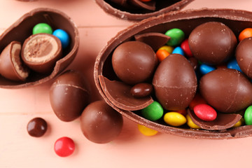 Chocolate Easter eggs on wooden table, closeup
