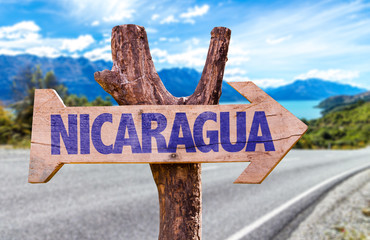 Nicaragua wooden sign with road background