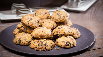 Cookies with raisins on wooden table