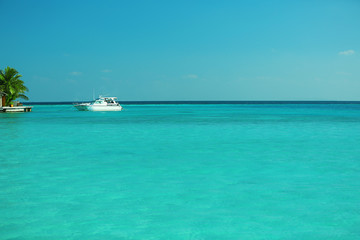 Fototapeta na wymiar Beautiful view of ocean with yacht, in resort