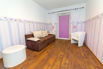 Fototapeta na wymiar Bright baby room with pastel colors wallpaper