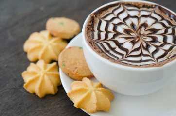 latte art coffee and cookie