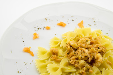 italian pasta called butterflies with shrimp salmon and basil