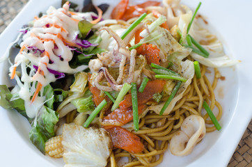 Stir fried spaghetti with teriyaki sauce and seafood