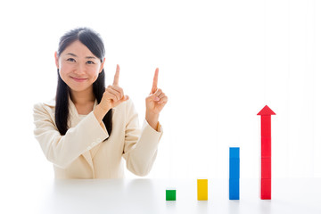 asian businesswoman with building block