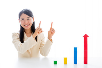 asian businesswoman with building block