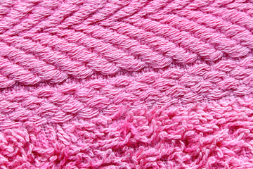 Motifs of pink towels in a macro.