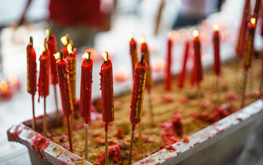 Flaming candles in chinese temple