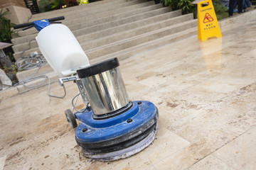 Close up blue polishing machine on the floor