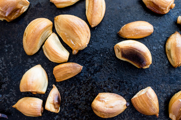 Toasted garlic on a black background