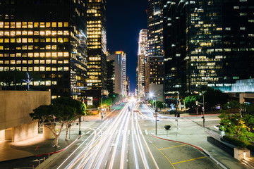 Fototapeta premium Traffic and buildings on Figueroa Street at night, in the Financ