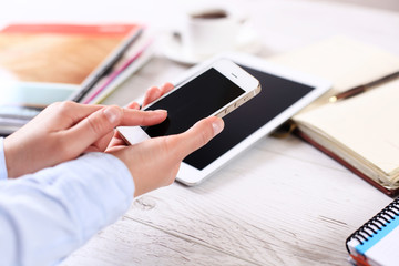 Modern workplace with digital tablet computer and mobile phone