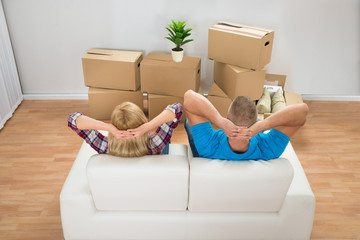 Young Couple Relaxing On Couch