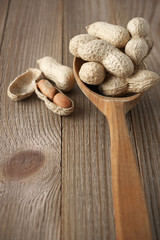 Peanuts in wooden spoon