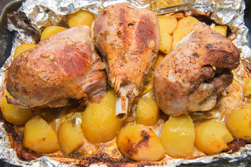 Dinner with baked in foil thigh turkey and potatoes