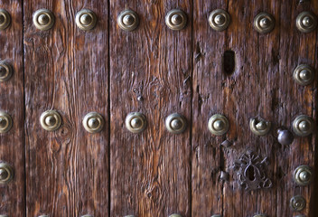 Wooden door with iron ornaments