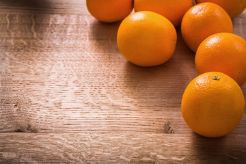 oranges on vintage wooden board with organized copyspace