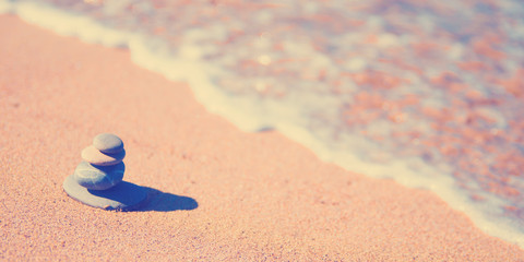 stones stacked up on beach
