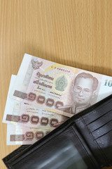 Banknotes of Thailand in wallet.