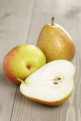 three ripe pears  on wood table