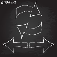 Arrow signs on black background. Chalk design