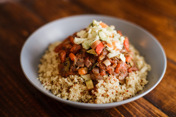 Vegan Dinner composed of Quinoa, Tomato sauce with Vegetables