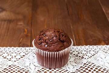 muffin chocolate on dark wood table