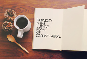 Inspirational motivating quote on notebook and coffee with retro