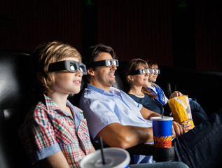 Family Watching 3D Movie In Theater