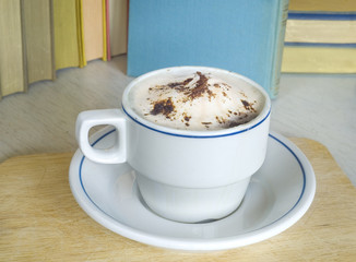 a cappuccino with books, reading, relaxing