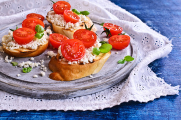 Sandwich with cheese, tomato and Basil
