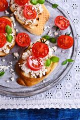 Sandwich with cheese, tomato and Basil