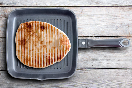 Tasty Grilled Naan Flatbread On A Square Pan